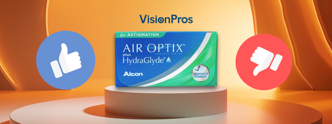VisionPros banner showing an Air Optix Plus HydraGlyde for Astigmatism contact lens box on a display pedestal, with thumbs-up and thumbs-down icons on each side.