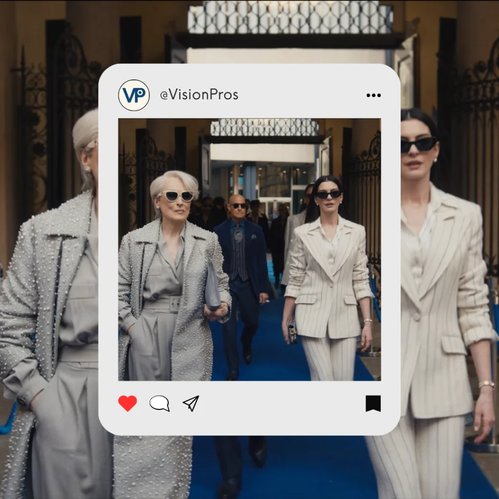Meryl Streep, Stanley Tucci, and Anne Hathaway walk down the blue carpet with sunglasses.