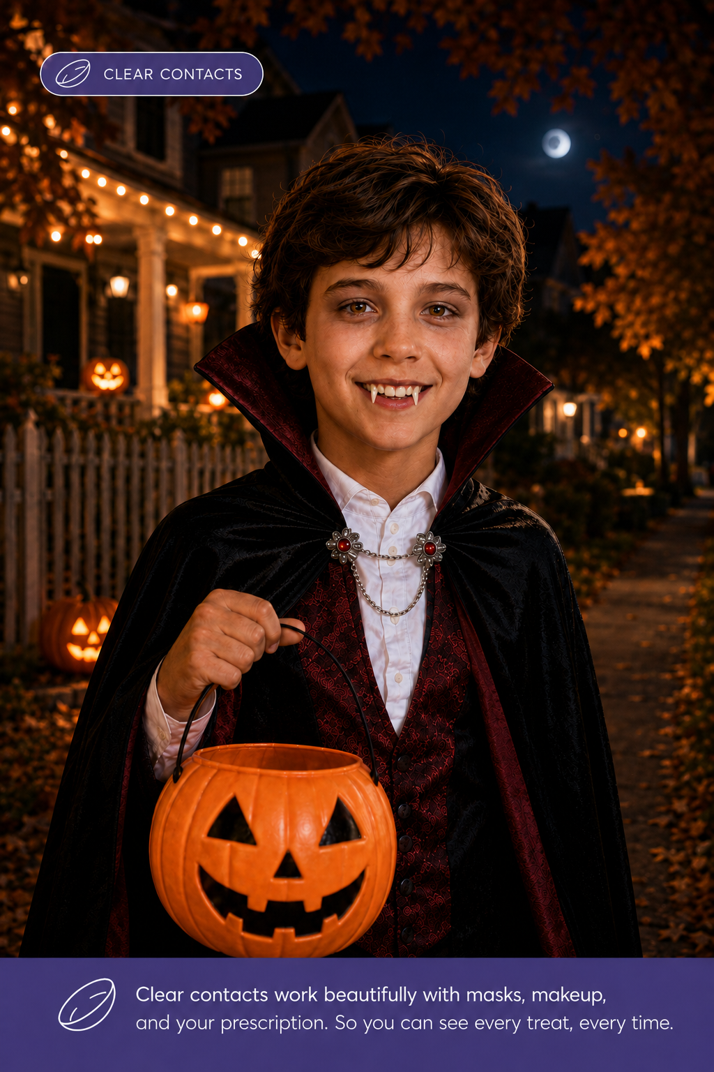 Boy in vampire costume wearing clear contacts while trick-or-treating at night